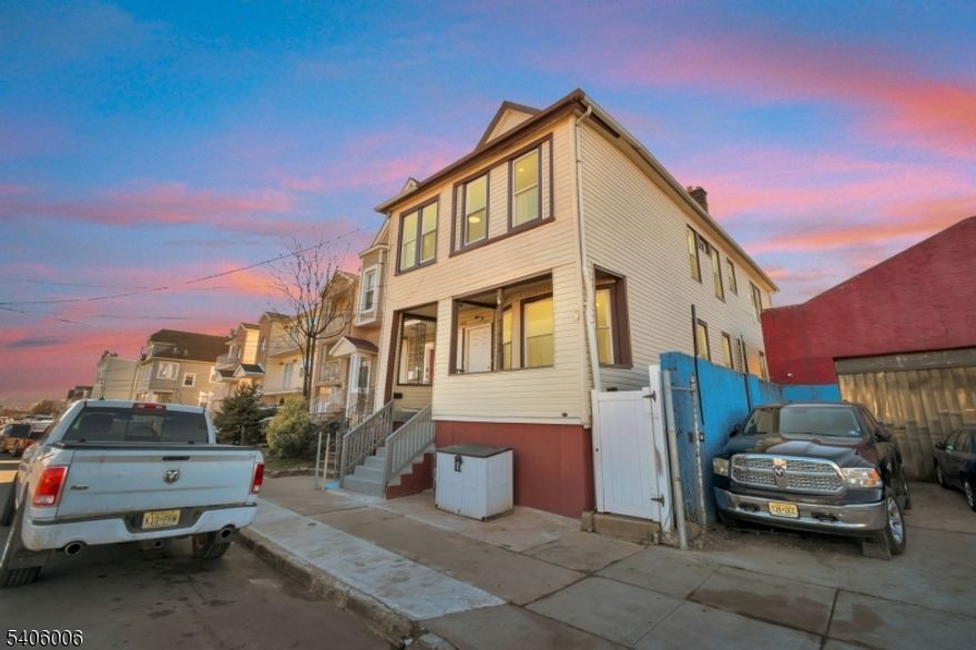 What is special on this Two-Family home:ULTIMATE PRIVACY: No house on one side! Enjoy your peace and quiet with a private area across the street perfect for jogging, walking, or relaxing without being bothered.INDEPENDENT LIVING: 3 Levels of independent access! The Basement, Second Floor, and Attic all have separate entrances. Perfect for peaceful living or rental income. Walk-out basement with 2 separate entrances. The chance to live in one unit and rent the other one.ROCK-SOLID BUILD: Feel the difference of a firm structure. Extra-wide "easy-move" staircases, 9-foot ceilings for massive natural light, and superior insulation that keeps the house warm and energy-efficient.THE "BONUS" ATTIC: Around 7-foot ceilings, plumbing ready for your imagination with incredible views of the airplanes. Use it as a studio, office, storage!LOCATION IS EVERYTHING:2 MIN: NJ Turnpike Entrance, 7 MIN: Elizabeth Train Station (Direct to NYC), 5 MIN: Jersey Gardens Mall & Nightlife, 5 MIN: The Port (Future Elizabeth Ferry!), 1 MIN: Trinitas Medical Center. VIEW: Watch the airplanes from your private attic window! Parking: Plenty of on-street spaces.Outdoor: Separate backyard access for every level.Safety: Quiet block, firm railings, and a secure porch for deliveries.Comfort: New lighting, New appliances, and sun-drenched windows throughout.