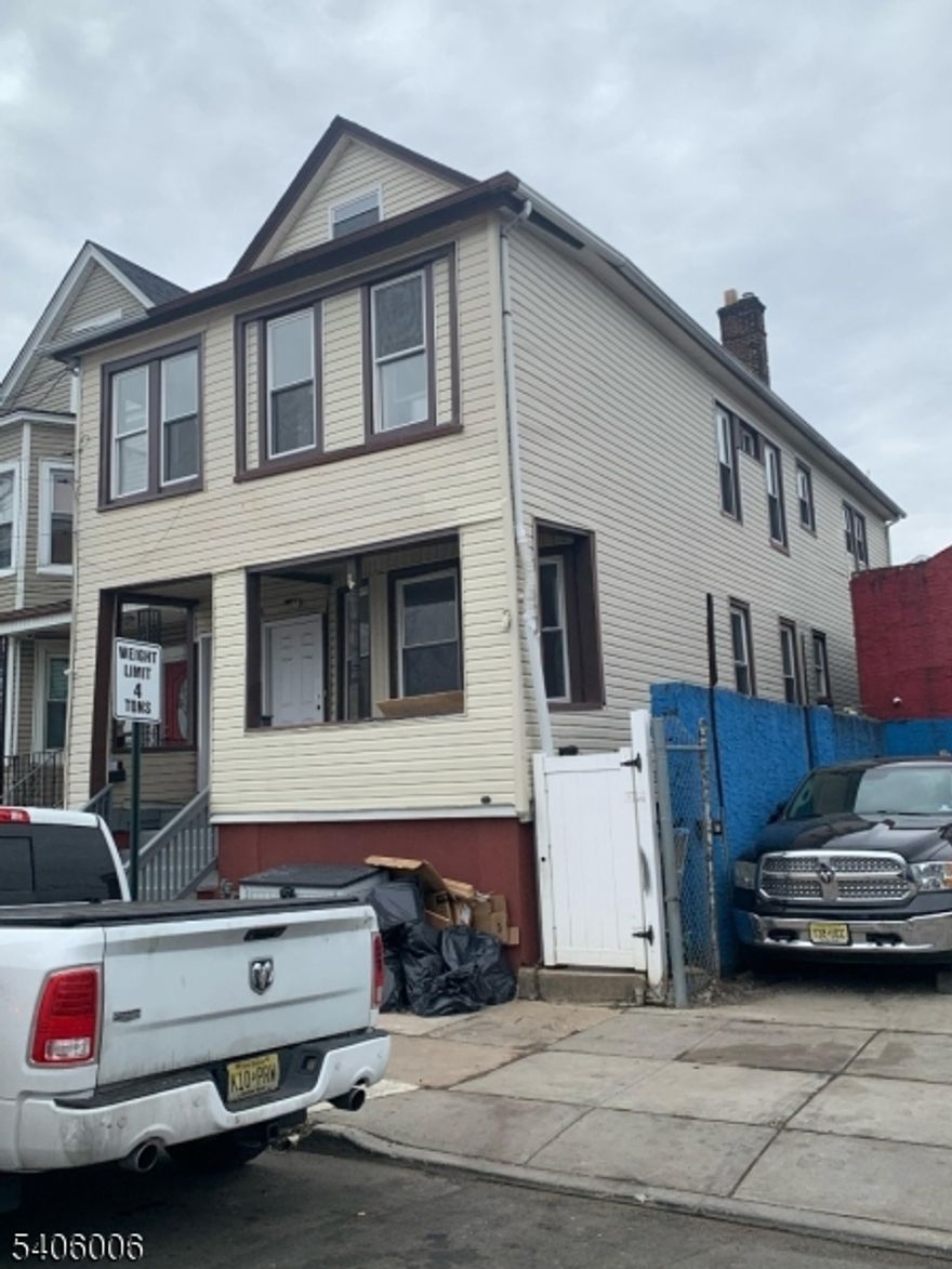 What is special on this Two-Family home:ULTIMATE PRIVACY: No house on one side! Enjoy your peace and quiet with a private area across the street perfect for jogging, walking, or relaxing without being bothered.INDEPENDENT LIVING: 3 Levels of independent access! The Basement, Second Floor, and Attic all have separate entrances. Perfect for peaceful living or rental income. Walk-out basement with 2 separate entrances. The chance to live in one unit and rent the other one.ROCK-SOLID BUILD: Feel the difference of a firm structure. Extra-wide "easy-move" staircases, 9-foot ceilings for massive natural light, and superior insulation that keeps the house warm and energy-efficient.THE "BONUS" ATTIC: Around 7-foot ceilings, plumbing ready for your imagination with incredible views of the planes. Use it as a studio, office, man cave, storage!LOCATION IS EVERYTHING:2 MIN: NJ Turnpike Entrance, 7 MIN: Elizabeth Train Station (Direct to NYC), 5 MIN: Jersey Gardens Mall & Nightlife, 5 MIN: The Port (Future Elizabeth Ferry!), 1 MIN: Trinitas Medical Center. VIEW: Watch the planes from your private attic window! Parking: Plenty of off-street spaces.Outdoor: Separate backyard access for every level.Safety: Quiet block, firm railings, and a secure porch for deliveries.Comfort: New lighting, New appliances, and sun-drenched windows throughout.