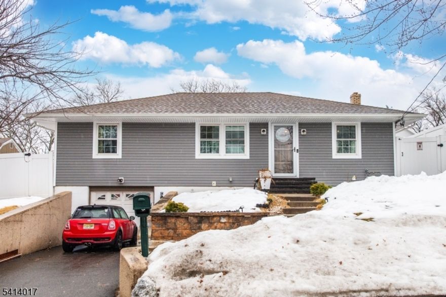 Welcome to 127 Dukes Rd, a beautifully maintained 3-bedroom, 1.5-bath ranch offering comfortable one-level living in a desirable Rahway neighborhood. This home features a spacious and inviting family room with skylights that fill the space with natural light and provide easy access to the beautifully landscaped, fully fenced backyard. The kitchen also boasts skylights, creating a bright and airy atmosphere perfect for everyday living and entertaining. Downstairs, enjoy a finished basement with a second family room, a dedicated laundry area, and direct access to the attached garage, ideal for extra space and storage. Out back, the yard is an entertainer's dream, featuring stunning hardscaping, an above-ground pool, and plenty of room to gather, relax, and enjoy the outdoors.  Desirable location close to malls, schools, restaurants, and shopping. Pool AS IS.