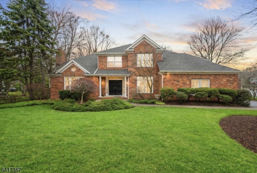 Hurry! Homes in this sought-after neighborhood are selling quickly & this exceptional colonial is no exception. Located in a desirable sidewalk-lined neighborhood, this stunning home welcomes you with a grand two-story foyer & a beautifully designed open floor plan. The main level features a private office, elegant formal living room with a picture window and fireplace. An archway leads into the dining room with easy access to the kitchen. The gourmet eat-in kitchen is perfect for entertaining & everyday living, offering high-end stainless steel appliances, custom cabinetry, a desk area & a large center island with seating. The bright breakfast area opens through sliders to a paver patio & flat fenced yard, ideal for outdoor gatherings. Family room boasts a second fireplace & oversized windows that fill the home with natural light. A laundry & mudroom complete the main level. Upstairs, the primary suite features a tray ceiling & custom built-ins. Don't forget about the updated spa-like bath with a soaking tub, large shower & dual sinks. Four additional bedrooms offer generous space, including one with a cathedral ceiling & another oversized bedroom with a walk-in closet & storage. The finished lower level provides additional living space with a family room & flexible area ideal for a game room or gym. Walking distance to Lake Valhalla, this community is known for its prime location and convenient access to major highways.