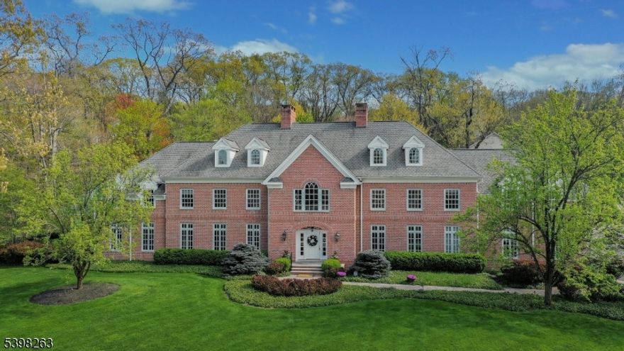 Exquisite 6 bedroom, 5.1 bath, 4 car garage, Custom Colonial home that features timeless architecture & design, with no detail overlooked. Natural sunlight floods the property creating a bright & airy living space throughout. The crown jewel of the home is the breathtaking entryway that is highlighted by a palatial like staircase and artisan wood trim finishes. A rare 1st floor primary suite boasts a fireplace, vaulted ceilings, multiple closets, a private entrance to an exterior patio space, laundry room, and a spa like ensuite- complete with its own 2 person jacuzzi tub, multiple vanities, and a stand up shower. An oversized gourmet kitchen presents with bespoke cabinets, granite countertops, state of the art stainless steel appliances, a massive prep island, a fireplace and an expansive eat-in kitchen area encased in windows. The 1st floor office and full bath offer an ideal work from home space, or guest suite. Dual staircases lead to the upper level where all bedrooms have en suite baths. A fully fenced-in backyard allows for multiple places to unwind and enjoy the natural surroundings of the property, among its 3 patio spaces, as well as a fully screened-in porch. Elevated and refined living in the hills of the Watchung Mountains.  Conveniently located to shopping and major highways.  Close to Warren.