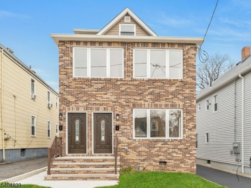 Beautifully renovated two-family home with side-by-side private entrances and all major updates completed, including brand-new appliances, roof, driveway, finished one-car garage, and oil tank removal.Upper unit features a bright eat-in kitchen with new appliances, wood floors, living/dining area, two bedrooms with closets, full bath, washer/dryer hookup, and a staircase leading to a loft ideal for an office or storage.Lower unit offers a separate entrance, full eat-in kitchen, new hardwood floors, dining and living areas, two bedrooms, full bath, and washer/dryer hookup in the large finished basement.Separate utilities. Turnkey property perfect for owner-occupants or investors.