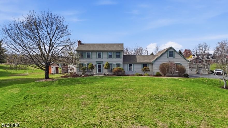 A rare opportunity to own a countryside hobby farm where space, character, and a flexible 4th bedroom/office come together effortlessly. Enjoy open land, scenic views, and a setting that backs to preserved farmland just minutes to Rt 80. The property includes a small barn with water, lean-to, and tack room, fenced areas for animals, a chicken coop, and additional outbuildings for storage. In addition to the home's 2-car garage, there is a detached 2-car garage with a walk-up loft, offering excellent space for storage, a workshop, or future creative use.The main home offers a spacious great room with a wood stove, vaulted wood ceilings, and exposed beams creating a warm, inviting atmosphere with a comfortable layout for everyday living. A standout feature is the private in-law suite with its own entrance, kitchenette, living space, full bath, and bedroom/office ideal for guests. A place where space, versatility, and a peaceful setting make it easy to feel right at home.