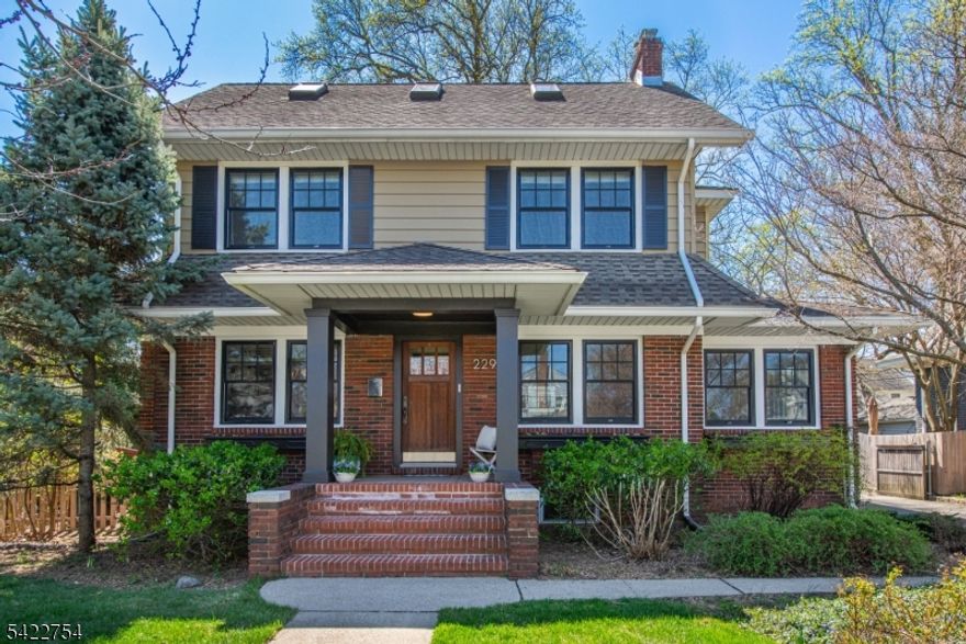 Located across from beautiful Brookdale Park and minutes from Watchung Plaza, this stunning 1920s CH Colonial perfectly blends timeless aesthetic with modern updates. A welcoming covered portico leads to a light-filled interior. The first floor features a large living room with a traditional fireplace & a sun-drenched sunroom featuring custom vaulted ceilings and built-in bookshelves. The dining room is accented by handprinted wallpaper and original leaded-pane windows. Modern wood and clad windows throughout ensure insulation, while picture rail moldings evoke charming period detail. The renovated kitchen offers stainless steel appliances, honed granite countertops, and custom maple cabinets, leading to a functional mudroom with built-in cubbies and slate flooring. The home offers oversized bedrooms with generous closets. The third-floor primary suite serves as a serene retreat with skylights, clever storage, and a modern European-style ensuite. A large open basement provides excellent storage and potential for a gym/rec/media room, alongside a spacious laundry room. Outside, a full-width bluestone patio overlooks a lush, landscaped backyard & a 2-car garage. The location is unbeatable near Watchung Plaza, Upper Montclair Village & Bloomfield's Brookdale shops. Enjoy 121-acre Brookdale Park or quick access to NYC via the Midtown Direct train, Boxcar bus, or via Route 3 & Garden State Pkwy. This move-in-ready property is the complete package for your best Montclair life.