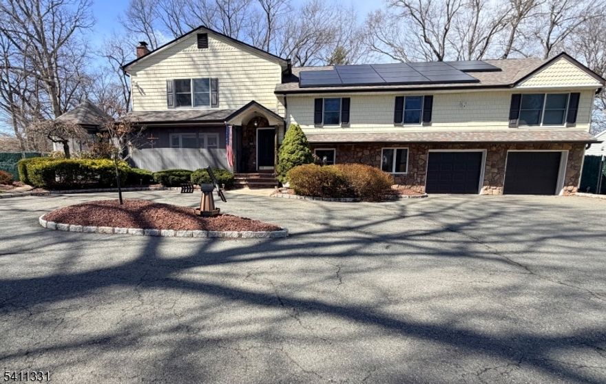 Resort-style comfort meets smart upgrades in this exceptional 5-bedroom, 4.1-bath home offering approx. 4,160 sq ft of finished living space, including a leisure room that can be used as a 6th bedroom. This beautifully maintained home blends classic warmth with modern efficiency in one of Livingston's most desirable locations.Expansive living areas are perfect for entertaining and relaxing, highlighted by four fireplaces (three gas, one wood-burning). The finished lower level offers flexible space for recreation, work, guests, or fitness, complete with a 4-person sauna. The primary suite features a cedar closet for added luxury and storage.The kitchen is equipped with a 6-burner Wolf commercial stove, XL SubZero refrigerator and freezer, Dacor double wall oven, dishwasher, and trash compactor.Step outside to a private, fenced-in backyard designed for year-round enjoyment: a covered swim spa pavilion, fire pit with 360-degree seating, 26-ft greenhouse with five raised beds, full sprinkler system, and rubber-surfaced playground with updated lifted playhouse and basketball hoop.Built for efficiency and resilience with a Tesla solar system and four backup batteries that serve as whole-house generators, whole-house water filtration, two-zone HVAC, and a 2020 roof. Close to top schools, parks, houses of worship, and commuting routes.