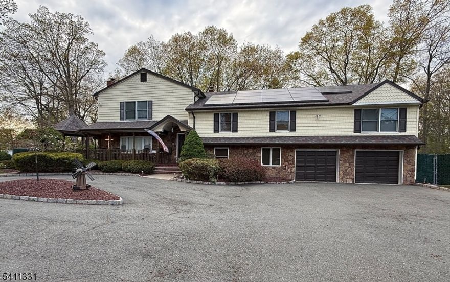 Resort-style comfort meets smart upgrades in this exceptional 5-bedroom, 4.1-bath home offering approx. 4,160 sq ft of finished living space. This beautifully maintained home blends classic warmth with modern efficiency in one of Livingston's most desirable locations.Expansive living areas are perfect for entertaining and relaxing, highlighted by four fireplaces (three gas, one wood-burning). The finished lower level offers flexible space for recreation, work, guests, or fitness, complete with a 4-person sauna. The primary suite features a cedar closet for added luxury and storage.The kitchen is equipped with a 6-burner Wolf commercial stove, XL SubZero refrigerator and freezer, Dacor double wall oven, dishwasher, and trash compactor.Step outside to a private, fenced-in backyard designed for year-round enjoyment: a covered swim spa pavilion, fire pit with 360-degree seating, 26-ft greenhouse with five raised beds, full sprinkler system, and rubber-surfaced playground with updated lifted playhouse and basketball hoop.Built for efficiency and resilience with a Tesla solar system and four backup batteries that serve as whole-house generators, whole-house water filtration, two-zone HVAC, and a 2020 roof. Close to top schools, parks, houses of worship, and commuting routes.