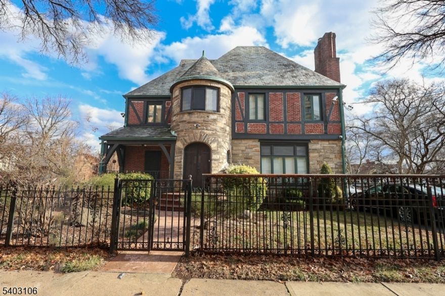 Welcome to this classic and elegant home ( English Castle ), located in the prestigious Weequahic section of Newark. It is two blocks from Weequahic Park, 20 Mins. from Newark Penn Station and 10 mins away from Newark International Airport. probably 30 mins to NYC. The property is on an oversized 100 x 154 lot with a metal fence. It is a very spacious single-family home with Eastern European craftsman and modern updates. The furnace is about 2 years old, and the owner has the warranties and documents for it. Careful updates have been made to this home over the years to keep it comfortable and current. Features include a slate roof, an open front porch, new front steps, 2 updated bathrooms, a new back patio, and a 13x11 balcony off the master bedroom for outdoor relaxation. Sun room off the dining room. Well-maintained classic woodwork and a very special, unique home. The attic has two bonus rooms. Very low taxes compared to the lot size and the GLA of the property. Just park your things and move in!
