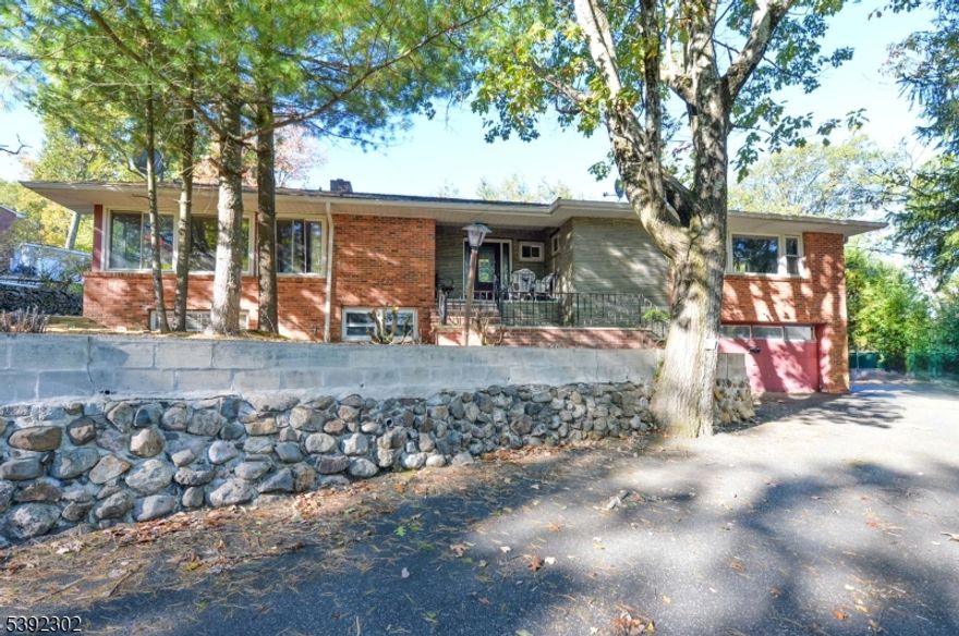 Very large Ranch in the pleasantdale section of West Orange, vacant and ready for immediate occupancy. Located on a corner lot that is approximately 16,000 square feet, with a large side yard. Great home for entertaining with 2 driveways, multiple patio areas, a walkout ground floor with summer kitchen, and a great layout with so much potential. The home has 3 bedrooms on the main floor, including the primary bedroom and primary bathroom that has been recently renovated. The hall bath is a great size with large tub and needs updating. The eat  in kitchen with a door to the back patio is ready for updating and customization. This floor also has a formal living room and dining room, family room, and an enclosed patio/3 season room. with access to the rear patio. The basement is hardly a basement as most of it is above ground, with so much space, including the huge converted garage that now adds to the square footage on this floor. there are a total of 5 rooms on the ground floor, with potential for extended living and a separate entrance off the summer kitchen. The home has great bones, and with some tlc can be one of the highest value homes in the neighborhood. Truly a great opportunity.