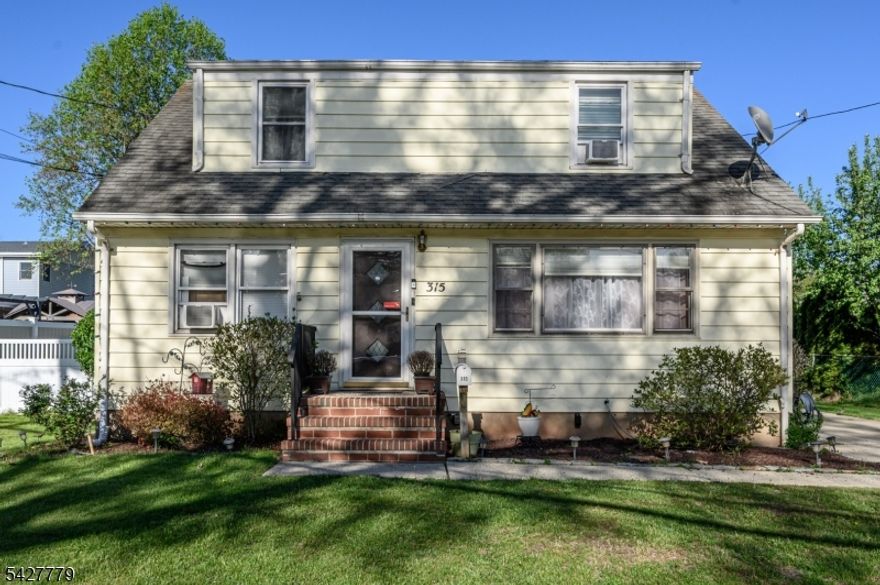Home Sweet Home! Lovely 4 Bed 1.5 Bath Cape with Detached 1 Car Garage and Full Basement in thriving Manville could be the one for you! Well maintained inside and out in a prime commuter location, just pack your bags and move right in. Step in to find a light and bright living room with big picture window that brings in tons of natural light. Gleaming hardwood flooring extends throughout. Beautifully upgraded eat-in-kitchen offers sleek SS appliances inc a pot filler, gorgeous granite counters, ample cabinet storage, recessed lighting, and center island that is ideal for gathering. EIK opens to the relaxing rear family room, adorned with trendy beamed ceilings and a cozy wood burning fireplace with stone stone wall, along with slider to the covered rear deck, the perfect spot to enjoy your morning coffee. Down the hall, find 2 generous bedrooms and the updated main full bath with tub shower. Head upstairs to find a convenient 1/2 bath along with 2 more large, private bedrooms. Full basement with utilities, laundry, and storage offers both interior and exterior access. Plush backyard makes summer entertaining easy, offering a spacious covered deck, above-ground pool, patio, and plenty of extra space to play, completely fenced-in for your privacy and comfort. Detached 1 car garage with long drivrway offers plenty of guest parking. All in a great neighborhood, convenient to shopping, dining, parks, the public transit bus line, and major roads for an easy commute. Don't miss out!