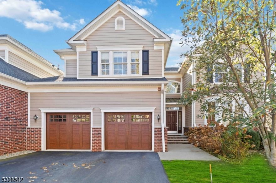 This one-of-a-kind luxury townhome is a true masterpiece located in the prestigious Wheatsheaf community. It is completely upgraded and offers a blend of style, functionality, and elegance. The open floor plan, soaring ceilings, and abundant natural light create a warm, welcoming atmosphere. The Chef's kitchen is standout, featuring high-end stainless-steel appliances, a marble backsplash, and a Grohe Blue water filtration system offering chilled or sparkling water. Gorgeous Restoration Hardware lighting throughout. The first-floor den makes an ideal office space, while the grand two-story living room with a gas fireplace, cathedral ceilings, and a wall of windows is perfect for relaxation and entertainment.  The second floor offers an inviting loft sitting room and four spacious bedrooms, including a stunning primary suite with a custom, one-of-a-kind walk-in. The lower level is designed for luxury living, with a media room, gym, and a full bar, creating an exceptional entertainment space. The home has a Crestron automation system to control security, audio, visual, HVAC, and more, with remote access and 12 audio zones.  The two-car garage features Liftmaster side-mount door openers and polyaspartic flooring. As an end-unit duplex, this home combines the best of both worlds: privacy and outdoor space like a single-family home, with the convenience of community living. Just over a mile to downtown Morristown, you're minutes from dining, nightlife, and the NYC Direct Train