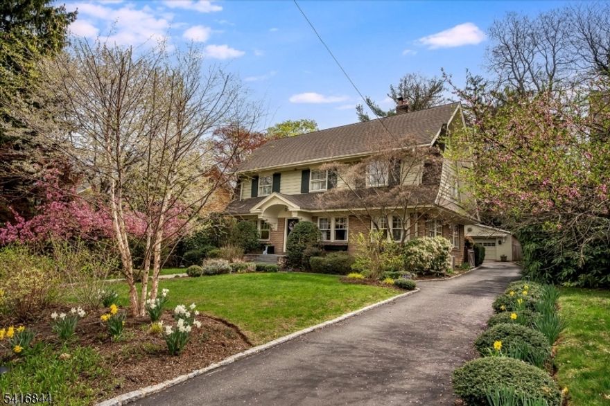 Welcome to 111 Montclair Avenue, a beautifully scaled 5 bedroom center hall colonial where classic architecture and thoughtful updates come together seamlessly. Original details, including hardwood floors and stained glass accents add depth and character, paired with a classic yet highly functional floor plan designed for everyday living. The living room, opens to a sun-filled adjoining room, ideal as a private office or quiet retreat. A formal dining room provides an elegant setting for gatherings and flows naturally into the expanded kitchen. Designed with both style and purpose in mind, the kitchen features a quartz center island with seating,Thermador appliances including double wall ovens and a dedicated dining area overlooking the deep, level private backyard. An expansive bluestone patio extends the living space outdoors, creating a natural setting for entertaining or relaxing. A mudroom and renovated powder room are thoughtfully positioned on the main level. The second floor offers 3 generously sized bedrooms, including a substantial primary suite w/ custom closet and a beautifully renovated spa-like bath. The third level provides exceptional flexibility with two additional bedrooms, a full bath, and ample storage, well-suited for guests, work from home needs, or evolving lifestyle needs. The finished lower level includes a spacious rec room. Just moments from Watchung Plaza and Walnut street's vibrant villages w/  NYC direct train, boutiques, coffee shops and more!