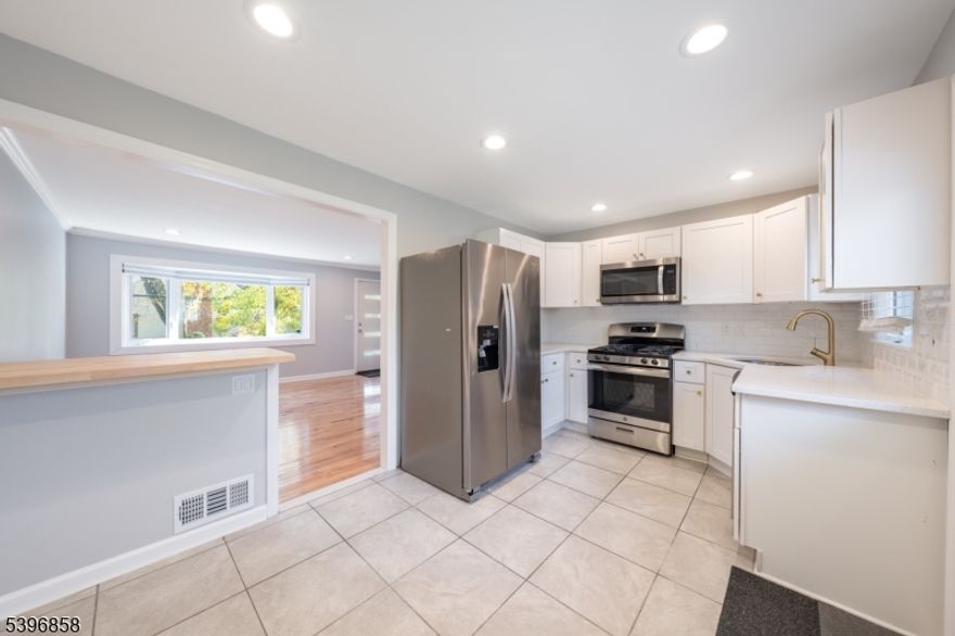 57 SPRINGFIELD AVENUE IS A SWEET SUMMIT SURPRISE NESTLED RIGHT ACROSS THE STREET FROM BEAUTIFUL BRIANT PARK! Newly renovated, move-in ready, andamazing location, you will fall in love with this easy-living 4 Bedroom, 3 Bath Cape. Enter right into the sunlit, modern Living/Family Room with sleek white built-in entertainment unit and fresh-finished hardwood floors. Updated Eat-In Kitchen with a mini-breakfast bar is delightful with Quartz countertops, crisp-white cabinetry, white subway-tile backsplash, and stainless steel appliances. Two bright Bedrooms, Full Hall Bath, and two generous Hall closets complete the First Level. Second Level boasts two additional bedrooms, including Primary Bedroom with En-Suite Bathroom with porcelain vanity, wood cabinetry, and shower with subway tile surround. Finished Lower Level is complete with a Recreation Room, Laundry Room, and updated Full Bathroom. Ample storage flourishes on the Lower Level, as well. Newly extended double-wide driveway is a plus! Partially fenced in, level Back Yard with stone patio, welcomes outdoor fun and entertaining. Convenient to NYC Transportation, top-rated Summit schools, 20 minutes to Newark Airport... PLUS blocks from the beautiful downtown Summit, vibrant shops and 5-star eateries, 57 Springfield Ave is where you will want to call this special "house  a spectacular "home. Client responsible for first $150 in repairs. NTN required with all applications.