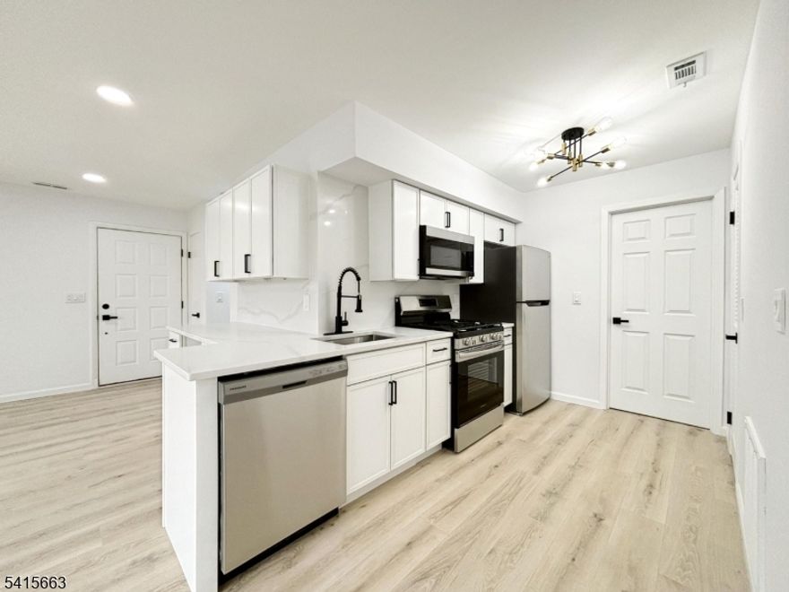 Beautifully detailed and renovated FIRST FLOOR END UNIT. Featuring 2 Bdrms & 1 Bath, this one floor unit is the epitome of comfort and convenience. All new Stainless Steel Appliances, Washer/Dryer, Lighting, Flooring, Fixtures, central HVAC furnace & condenser, and more. The renovated kitchen features luxury slim shaker cabinets, quartz countertops and backsplash, and generous storage, plus extra space ideal for a wine fridge or home office nook! Open-floor concept Living & Dining Area with abundant natural light and sliding glass doors that lead to a private deck. Enjoy this 4-Season Community, HOA Pool, Minerals Resort & Spa, Mountain Creek Skiing and Waterpark. Crystal Springs Resort & the popular Warwick Village only minutes away. Bars, restaurants, nightlife, golf, mountain biking, shopping, day spas and many year-round festivals. Only 50 miles to NYC! Perfect for year-round living, investment opportunities, or an ultimate vacation getaway! Must See!!