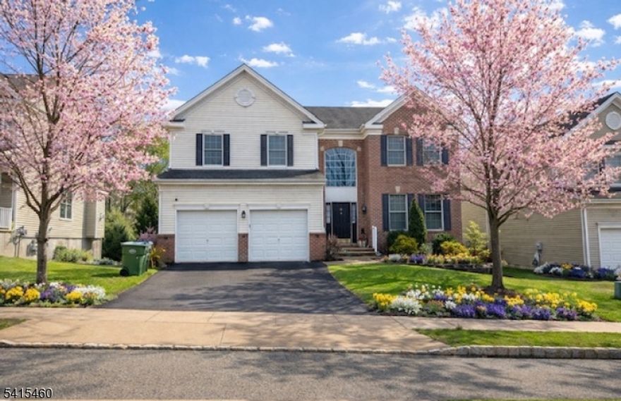 Welcome to this spacious & inviting 4-bedroom, 3.5-bath Center Hall Colonial, perfectly designed for comfortable everyday living & effortless entertaining. A welcoming foyer greets you as you enter the home, leading to a thoughtfully designed main level featuring hardwood floors throughout. The large kitchen offers an abundance of cabinetry, a generous pantry, & an eat-in area with sliders to a deck overlooking the above-ground pool, perfect spot for morning coffee or summer gatherings. The main level also features a formal dining room, formal living room, and stunning family room with cathedral ceilings that creates an open & airy atmosphere. A powder room & convenient first-floor laundry room complete this level. Upstairs, you?ll find 4 spacious bedrooms, including a primary suite & bath with a soaking tub & stall shower. A full main hall bathroom serves the additional bedrooms, & a pull-down attic provides convenient storage. The finished lower level offers versatility & space for everyone. Enjoy a large recreation room, additional family room with sliders leading to a lower-level deck with hot tub, and a media room complete with projector and screen wall?perfect for movie nights and entertaining. This level also includes a full bathroom and an additional storage room. Outside, the home is set on a large, fenced-in lot surrounded by mature privacy trees, creating a peaceful backyard retreat with plenty of space to relax, entertain, and enjoy outdoor living.