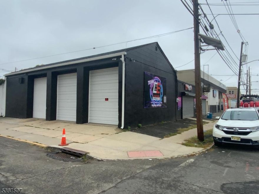 2 Commercial and residential properties for sale on the corners of East Broad st, Chestnut st and Walnut st. Total 8,057 sq ft property #1 1169-1177 East Broad lot #3 Block 292 Tax $20,879.08 with 2 apartments + car wash business (business NOT INCLUDED) apartment #1 2 bedroom, Liv Room, kitchen, bathroom, $1200, tenant pay own electric and gas. apartment #2 Studio $1,100.00 with utilities included M to M. Commercial Business not included Car wash 5,251 Sq Ft  rent $3,640.00 lease expire 8/31/27.  Tenant pay own utilities, property #2 1179-1181 East Broad st w 3 drive in doors   lot #2 Block 292 Tax $6,186./91 Used as Car detail (business not for sale) 2,805 sq ft rent $2,575,00 lease exp 6/30/26 tenant pay electric and gas. Total gross income month $8,515.00. possible to include in the sale another property next door.
