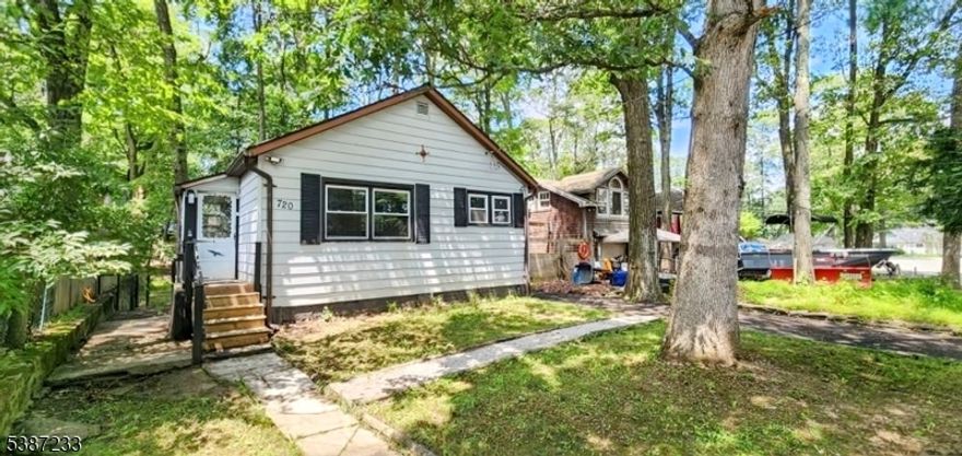 Exceptional 2-Bedroom, 1-Bathroom Residence Near Lake Hopatcong?Discover the perfect blend of comfort, style, and convenience in this meticulously maintained home. Offering an ideal layout for a starter home or for those looking to downsize, this property has been significantly updated for immediate enjoyment.?The residence boasts a suite of recent enhancements, including a brand-new roof, a newly installed driveway, and a new water softener. Inside, you'll find elegant, newly stained hardwood floors that flow through the main living areas, complemented by a fresh, modern coat of interior paint.?Situated just minutes from the beautiful shores of Lake Hopatcong, this home offers an unparalleled opportunity for relaxed, convenient living.