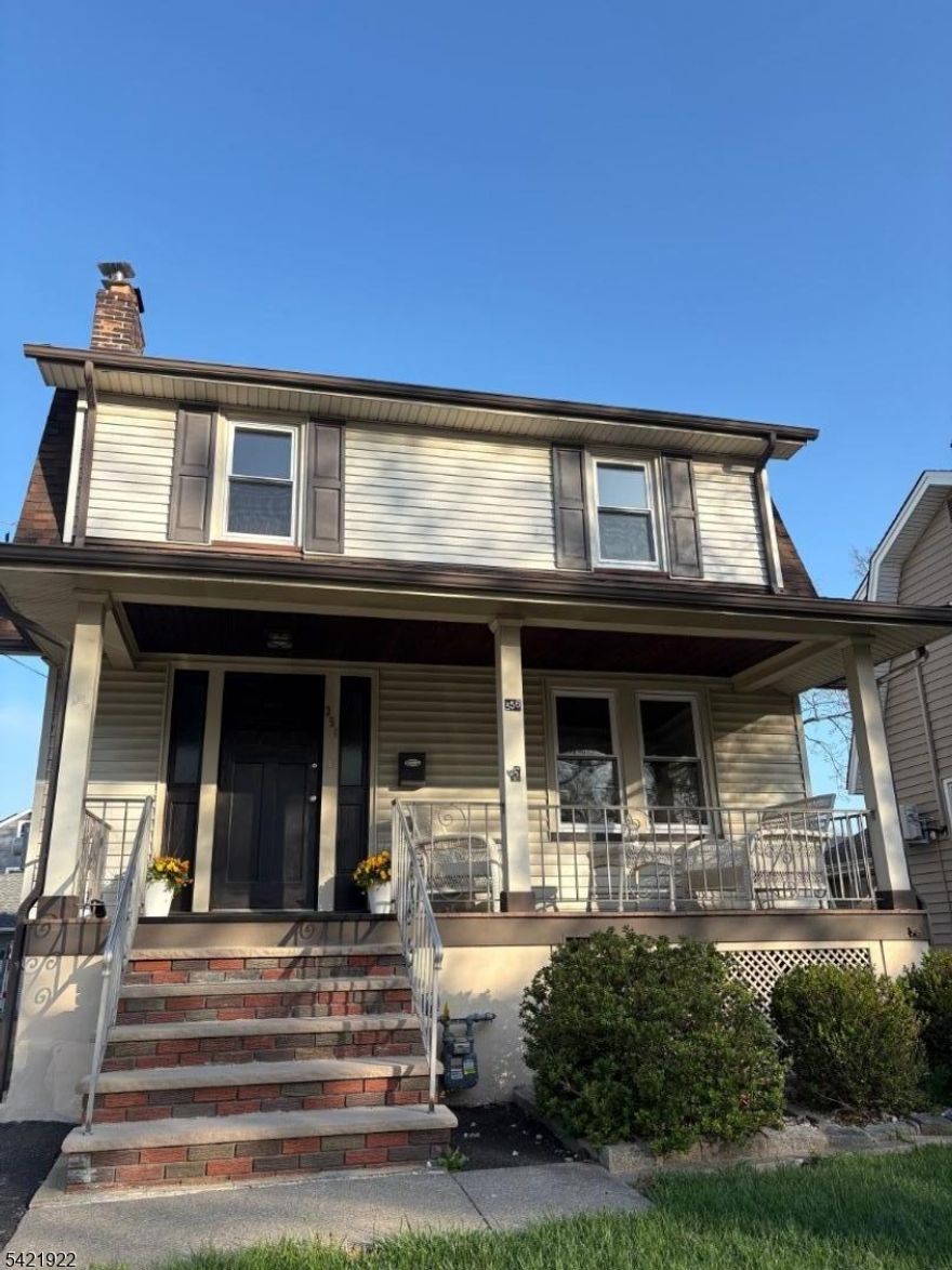 Thoughtfully renovated and move-in ready, this charming home offers the perfect blend of modern updates and timeless appeal in a prime Cranford location just minutes from downtown shops, restaurants, parks, and NJ Transit, with convenient access to major highways. A welcoming front porch sets the tone and provides the perfect spot to unwind. Inside, the sun-filled living room features a classic brick fireplace, while the dining room flows seamlessly into a brand-new kitchen with a center island, stylish cabinetry, and stainless-steel appliances ideal for both daily living and entertaining. The first floor also offers a full bath and a flexible bonus room that can be used as a recreation room, fourth bedroom, home office, or guest space. Upstairs, you'll find three bright bedrooms and a full bath, including a spacious primary bedroom with room for a king-size bed and two closets. Additional features include hardwood floors throughout, a basement with laundry and storage, and a private driveway leading to a detached garage and backyard. A fantastic opportunity to own an updated home in one of Cranford's most sought-after neighborhoods.(Driveway is not shared. Property is not in flood zone. )