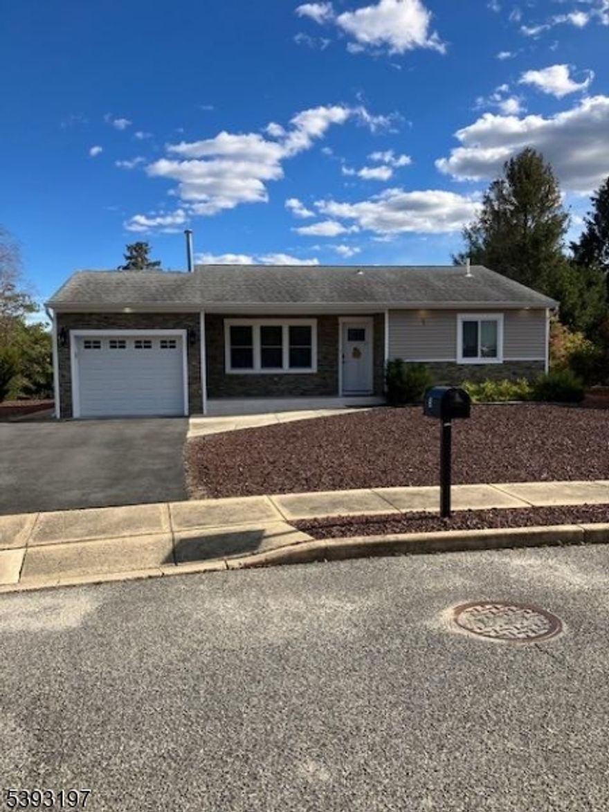 MOVE-IN READY! Completely Renovated 2022. Not occupied since 2022 closing...This desired Sussex model has an open floor plan with a electric fire place in living area with floor to ceiling mantle.  Also fire place located in enclosed Florida room. Newer luxury vinyl plank flooring, crown molding and wainscoting throughout home. EIK with center island. Newer appliances,quartz counters, fixtures and cabinetry! NEW asphalt double wide driveway! Covered front porch with newer stone exterior. Back yard has beautiful panoramic views of open and wooded Common Area. Sellers will contribute solar credits and one time HOA fee upon closing!