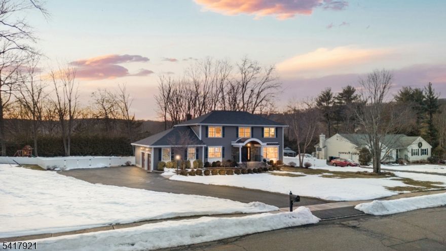 MODERN CHARM MEETS SUBURBAN SERENITY! 1 Radcliffe Drive is a tastefully refreshed 4-bedroom, 2.1 bath Center Hall Colonial that blends timeless architecture with modern updates. Set on 1.08 beautiful acres, this home offers the perfect balance of privacy and neighborhood living, just minutes from top-rated Roxbury schools, Horseshoe Lake recreation, and local parks. Arrive via the new driveway and step into a welcoming entry foyer. The formal dining room, highlighted by a large picture window, fills the space with natural light and creates the perfect setting for gatherings. The living room invites cozy evenings with its classic red brick fireplace and striking bluestone mantel. The eat-in kitchen is designed for both everyday living and entertaining, featuring custom cabinetry, luminous quartz countertops, and stainless steel appliances. Sliding doors lead to a large elevated deck overlooking the level, park-like backyard, complete with a propane fire pit and new PVC fencing for added privacy. Upstairs, the serene primary suite offers a beautifully renovated ensuite bath, while the hall bath has been refreshed with a new vanity and modern wood-look tile flooring. An expansive lower level provides flexible space for a gym, office, or recreation room. With a newly installed Tesla Wall Connector and convenient access to Route 10 and NJ Transit, this home truly has it all.