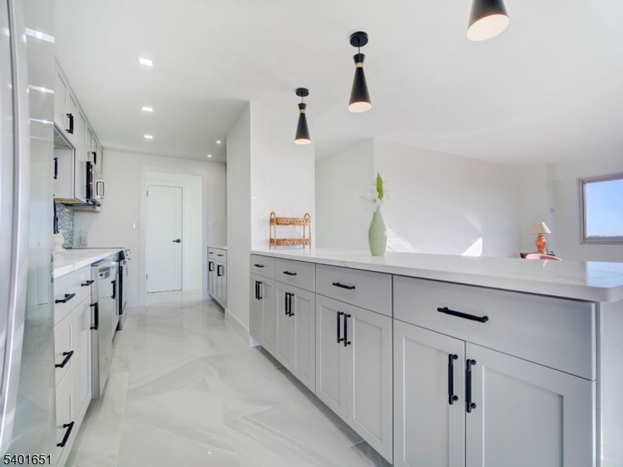 A rare, once-a-year opportunity at Harrison Park Towers. This just-completed, fully renovated three-bedroom, two-bath corner COOP offers a level of finish, size, and positioning rarely available in the building. Located on the 9th floor with southwest-facing views, this end unit is flooded with natural light and offers an exceptional sense of space and privacy.Residence 9L stands apart with its larger fp and thoughtful redesign. The brand-new kitchen showcases top-tier appliances, a unique built-in seating area, and an open-concept galley layout ideal for both everyday living and entertaining. The COOP also features 3 generously sized bedrooms, 2 sleek, newly finished bathrooms, and striking white marble flrs throughout, delivering a clean, modern, and cohesive aesthetic. HPT is a well-established, full-service coop offering a 24-hour concierge, all utilities included (electric, heat, hot water, and A/C),  parking ($60/month, one space), comp jitney service to NYC trans and local shopping, a beautifully landscaped private garden, first-floor fitness center, and a bright, well-maintained laundry facility. Ideally located just mins from the GSP and Rt 280, this COOP represents outstanding value and convenience making it one of the most compelling offerings currently available in Essex County. Owner-occupancy required. Board app req.20% down payment a must. Shares: 440. Monthly maint: $2,121 incl taxes, building maint, and all utilities. Sq footage is approx.