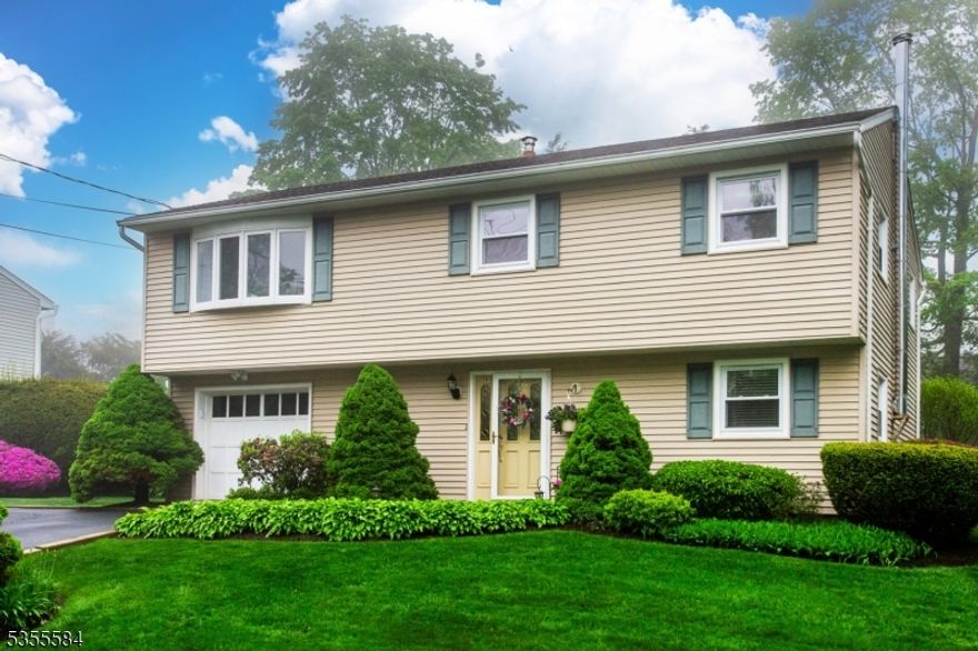 Welcome to this charming home nestled in the beautiful lake community of Cliffwood Lake, just minutes from Route 23. This delightful 3 bedroom, 1.1 bath residence offers the perfect blend of comfort and outdoor enjoyment. Step inside to find a clean, well maintained interior that radiates warmth and charm. The main floor offers 3 spacious bedrooms & a full bath. The expansive living areas are ideal for relaxing and entertaining. The sun filled kitchen is open with lots of counter space and glass doors leading to a beautiful expansive deck overlooking the gorgeous, professionally landscaped yard. The lower level offers a large room with wood burning stove, powder room and access to a beautiful patio and stunning yard. Additionally this home offers central air, a nice level lot & additional parking.  The property is brimming with pride with beautiful landscape specimens, perennials and tons of color. Enjoy easy access to community amenities including the lake, beach, baseball field & more! This home is a rare find, combining a great location with inviting features in a welcoming community. Don't miss this chance to make it yours!