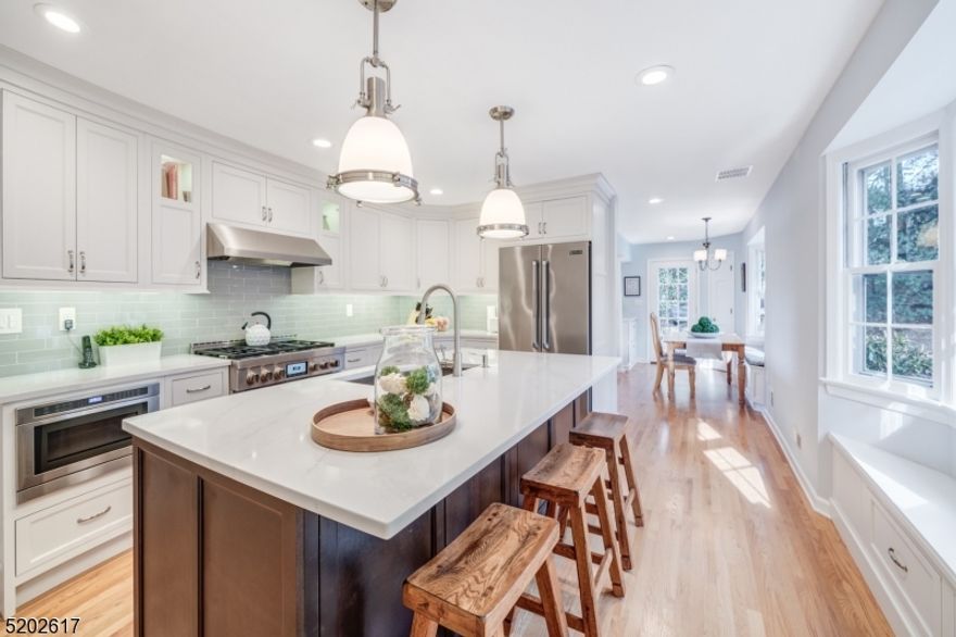 Get ready to be DAZZLED by this amazing Summit home! Don't be deceived by the outside, this home boasts almost 6000 square feet, 6 bedrooms, 4.1 Baths, extraordinarily sized rooms, tons of Storage/Closets, and all the space you'll need for everyday living, working from home, and/or entertaining. Located on a sought-after block in the Brayton Elementary School District with proximity to Memorial Field, easy access to Midtown Direct train service, and convenience to fantastic shopping and restaurants in downtown Summit. EXQUISITE Gourmet Chef's Kitchen with crisp white cabinetry, custom island, quartz countertops, and stainless appliances. Magical Breakfast Room. Huge Living Room with fireplace and bay window. Formal Dining Room. Family Room with fireplace and serene views. Ensuite Bedroom (great for guests) and Office/Bedroom on 1st Level. 2nd Level boasts Primary Suite with soaring pine ceilings, adjacent Office/Sitting Room, fireplace, Walk In Closet plus 2 other closets, Private Deck, and spa-like Bath. 3 other Bedrooms on 2nd level are sundrenched, roomy, and include Walk-In Closets. ENORMOUS Lower Level with HUGE "Walk Out  Recreation Room with Dry Bar, Mud Room Area, potential Exercise Room, Laundry Room, Half Bath, and 2 Car Garage. Fantastic Deck for outdoor entertaining. 30 Silver Lake Drive, located in one of Summit's most coveted neighborhoods, simply cannot be missed!