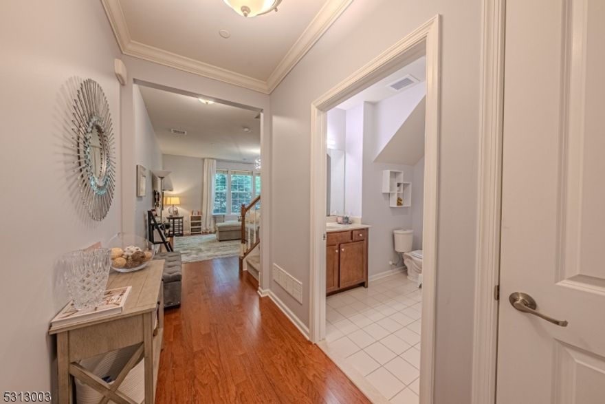 Located amid natural beauty-within close proximity to all of life's convenience. This spectacular townhome offers residents light, bright and OPEN living. Conveniently located in Morris Plains which provides easy access to major highways, NYC Direct Train Station & buses for an easy commute yet all the charm and benefit of small town living. Desirable Chadwick Model floor plan in sought after Coventry Park. Beautiful engineered hardwood floors throughout. Lovely, open concept kitchen, dining and living room. Updated kitchen with SS appliances, granite countertops, breakfast bar & pantry! Convenient laundry/mudroom off the one car garage. Slider to the back patio. Convenient full bath. Upstairs, a primary bedroom with full bath and walk-in closet. Another generous sized bedroom & full bath with tub shower. Pristine condition. Development is only 12 years young! Tastefully updated. The attached 1-car garage offers extra storage and a dedicated driveway. Thermal windows and doors. HOA only $325 a month! Wonderful community with curbs and sidewalks. Playground too! Walk to Uncle G's shopping plaza, Stop & Shop, Starbucks, Millers Ale House, the BRAND NEW District 1515 ("a New Town Center") etc! Just 1 Mile from Midtown Direct Train Station & walkable Morris Plains' charming downtown with an array of diverse dining & shopping options. Township has a township pool, community center, before/after school programs and so much more! Excellent schools. Close proximity to Morristown.