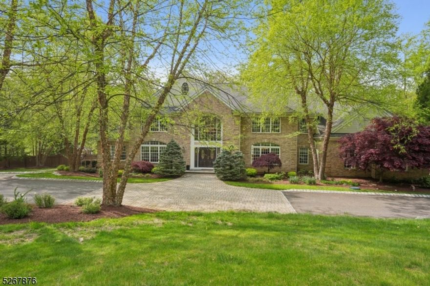 Absolutely enchanting! This brick-front Colonial was custom-built in 2003, a true masterpiece on 5.6 acres. It has 13 rooms, 6 bedrooms, 4 1/2 baths, and 2 fireplaces, this luxury home is a sanctuary of unique features and unparalleled quality. The spacious floor plan seamlessly flows, offering multiple options for home offices. The great room, located off the kitchen, is truly stunning, providing access to the rear yard, the foyer, and a soaring ceiling opening to the 2nd-floor gallery. The game room, complete with a full-size pool table, is perfect for entertaining or enjoying a relaxing game. The library/office is handsomely appointed with French doors for privacy. Calling all chefs! The recently updated kitchen includes a new quartzite island countertop, a 6-burner+grill GE Monogram range, KitchenAid dishwasher, and Sub-Zero refrigerator. Formal dining reaches a new level of elegance with its beautiful inlaid hardwood floor accents. Discreet first-floor guest quarters feature a spacious bedroom and ensuite full bath. The second floor offers five airy bedrooms, two of which feature ensuite full baths. The huge primary suite beckons with an inviting aura, complete with a fireplace, dressing room area, and a sumptuous bath. Step outside to an oasis of leisure. The sparkling in-ground heated pool & spa await, surrounded by an expansive patio, multi-tier deck, and pergola. Embrace the breathtaking beauty of the area with a direct path to Buttermilk Falls.