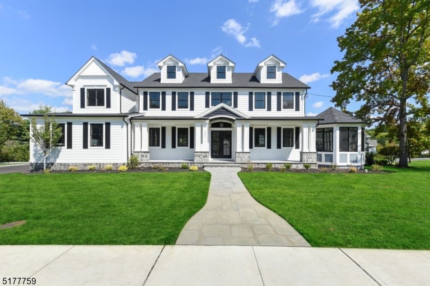 Welcome to this grand & elegant 6 BR home boasting multiple living spaces over 7300 sq ft. This brand new build is the perfect blend of modern comfort & stylish design w/ top-of-the-line finishes, expansive millwork & an amazing floor plan. Step through double entry doors into an impressive foyer w/ 2 story ceilings then make your way into the open concept family rm, bathed in natural light featuring a coffered ceiling & gas fpl. Fam rm opens to a gourmet chef's kitchen w/ Thermador SS appls, huge center island, quartz countertops & wet bar w/ bev fridge. This floor also features a dining rm w/ tray ceiling, living rm w/ 6"crown molding & a gorgeous rotunda sunroom. In-law suite enjoys a sep entrance w/ private office/sitting rm & ensuite. Well-equipped mudrm & powder rm complete this level. Follow the elegant staircase up to 4 more BRs. The lux primary ste boasts a dressing/sitting rm, gas fireplace, huge walk-in closet & an ensuite w/ a freestanding claw-foot soaking tub. Radiant-heated Carrera marble floors & shower & an impressive double vanity complete the primary bath. The 2nd BR on this level is ensuite, while BRs 3 & 4 share access to a Jack-and-Jill bath. The 3rd level you can find a generous ensuite 6th BR. Completing the layout is the fully finished walkout basement w/ a full bath & space for a wine cellar. Gorgeous bluestone deck with retractable awning & wrap-around paver patio are ready for entertaining. There is also plenty of room to add a pool if you desire.