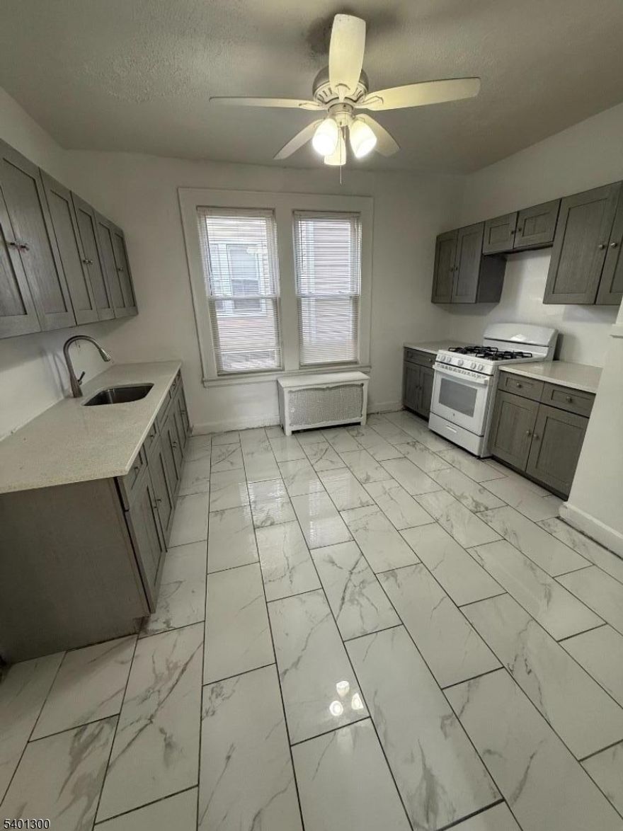 Welcome to your next home! This beautifully renovated 2nd floor apartment offers 3 bedrooms and 1 renovated bathroom. brand new flooring along with an open concept living with a separate dining area leading to the updated kitchen with quartz countertops. The home offers plenty of closet space as well as additional pantry space. 1 parking space is available. Located on a quiet tree-lined street in East Orange, 85 Sunnyside Ter. combines comfort and convenience.The home is located within walking distance to NJ Transit trains to NYC and with easy access to the GSP and I-280 for an easy commute.