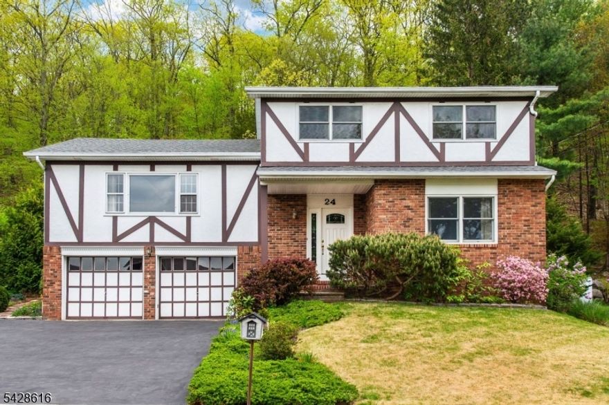 Located on one of the town's most picturesque streets, this sugar maple split-level home offers exceptional living space and scenic tranquility. The spacious ground level includes a generous foyer, bedroom, office/den, powder room, and a family room with a sauna. The main level showcases an open-concept layout with an eat-in kitchen, dining room, and living room, while the upper level features a primary en-suite with a walk-in closet, two additional bedrooms, and a full bath. Hardwood flooring extends throughout the home, with updated ceramic tile in the kitchen and dining areas. The private backyard is a true retreat, offering sweeping views of woods and mountains, a patio with pergola, and lush plantings including raspberries, black currants, peonies, and roses. With a newer roof (2022) and central air (2024), this home is move-in ready and beautifully maintained. Close to schools, parks, and hiking trails this is truly a beautiful place to call home.