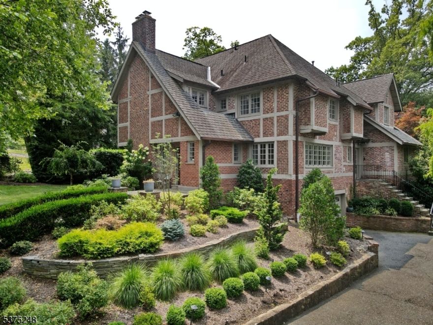 Updated 5 beds 4 full and 2 half Tudor in the heart of Essex Fells.2 fireplaces,smart house,library w/ french doors to the patio,new gourmet kitchen with large island. private yard with sports court