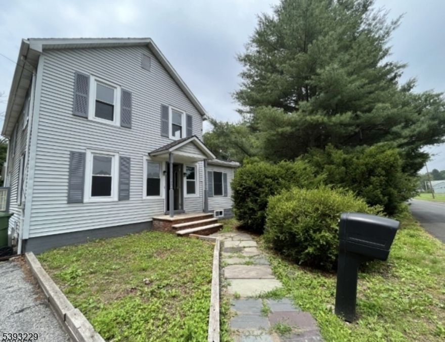 Charming 4-bedroom, 2-bath colonial home on a .43-acre open lot in Blairstown Township. This residence offers spacious living with an open first floor featuring a large living room (23x20), formal dining room (19x14), and an eat-in kitchen (23x10). The primary bedroom is conveniently located on the first floor, with three additional bedrooms upstairs. The home includes a full unfinished basement, vinyl siding exterior, deck, and outbuildings. The property offers a 4-car driveway and easy highway access via Rt 94. Come create your dream home in a peaceful setting. Do not access outbuilding in rear of property.
