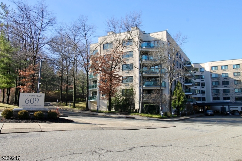 Welcome to this bright, renovated 1410 square foot Condo at The Newstead, in beautiful South Orange.  2BR, 2.5BA, lots of closet space, cozy dining area and bright kitchen. Large balcony, strorage cage on lobby level, 2 indoor parking spaces and outdoor spaces available. Heat and hot water included in maintenance. Lovely views of South Mountain Reservation can be seen from your windows & private balcony.  Amenities include 24 hour doorman, concierge & valet parking, beautiful marble lobby, pool, fitness room & party room. Wow!! This is the one! Apartment will be emptied of furniture on January 8th.  Key with Doorman. Lockbox available starting Monday