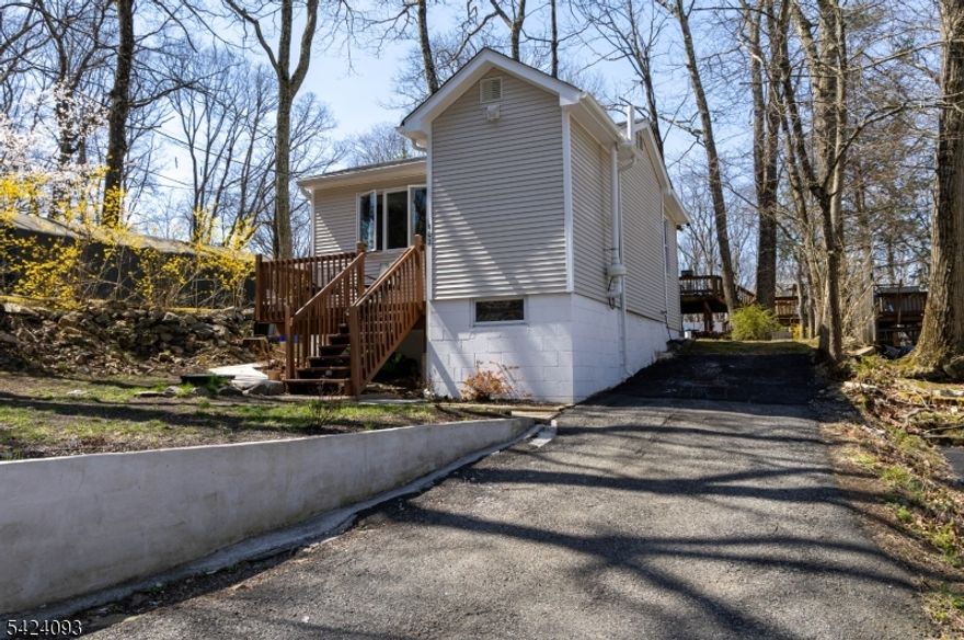 Welcome to 102 Dartmouth Trail in Hopatcong, NJ! This charming 2 bedroom-1bath home is nestled in a quiet and peaceful neighborhood, offering beautiful mountain views and a relaxing atmosphere. Enjoy a private yard perfect for outdoor gatherings, gardening, or simply unwinding in nature. Conveniently located close to local markets, shopping centers, and everyday essentials, this home combines comfort, privacy, and accessibility. 2 car parking lot. A perfect place to call home!