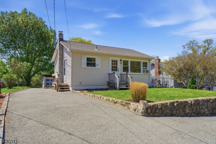 Featuring a brand new roof this well maintained ranch has a clean curb appeal, a wide driveway, and a landscaped front yard, conveniently located just minutes from Lake Hopatcong. Inside, hardwood floors run through the living areas and bedrooms, paired with recessed lighting, neutral paint, and bright windows. The updated kitchen features white cabinetry, tiled flooring, dark countertops, and a built in microwave. Bedrooms offer hardwood flooring, ceiling fans, and good closet space. The full basement offers potential to add more living space or a ton of storage. The backyard is a strong highlight with fenced green space, mature trees, garden beds, a storage shed, and a defined gravel seating area for outdoor use. A solid, practical home with updated finishes, usable outdoor space, and a spotless presentation throughout. Highest and best offers are due by Wednesday 5/13 at 5pm.
