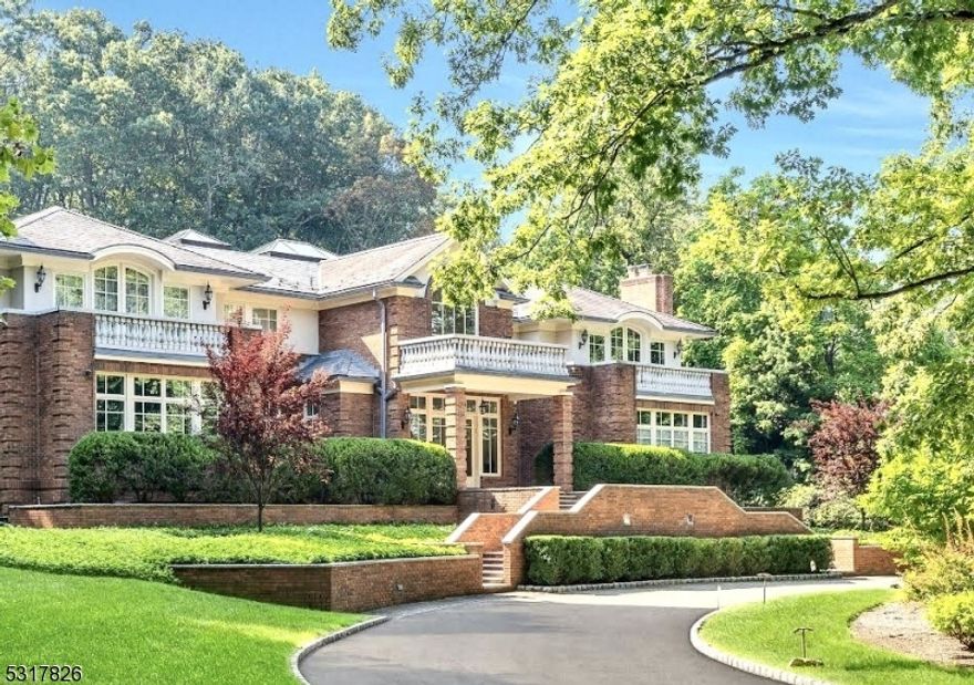 Welcome to 253 Hartshorn Drive, a luxurious sanctuary set in the prestigious Hartshorn section of Short Hills on over 2 private acres. From the moment you enter the circular driveway, this residence radiates grandeur with its blend of brick and stucco exterior, crowned by a stately slate roof. Inside, an expansive two-story great room with soaring ceilings sets the tone for elegance, further amplified by abundant natural light from walls of windows and three skylights. The new gourmet kitchen is a culinary masterpiece, equipped for both intimate and grand entertaining. Boasting six bedrooms, each with an en-suite bath, the home offers unparalleled comfort while three additional half-baths add convenience. Outdoors, a stunning pool and adjacent pool house with kitchen and full bath provide an oasis for relaxation and entertainment. The property also features a spacious four-car garage. 253 Hartshorn Drive is not just a home; it is a lifestyle of opulence and serenity.