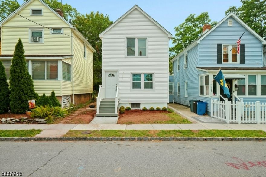 Welcome to 76 Mitchell Avenue, a beautifully renovated single-family home in the heart of West Orange, NJ. This charming residence offers 3 bedrooms and 2 full bathrooms, thoughtfully updated with modern finishes while maintaining a warm and inviting atmosphere. Step inside to discover a bright and open layout with fresh neutral tones, recessed lighting, and stylish new flooring throughout. The spacious living room flows seamlessly into a brand-new kitchen featuring sleek white cabinetry, stainless steel appliances, and elegant quartz-style countertops accented by a modern backsplash. A cozy dining area with plenty of natural light makes this the perfect space for entertaining. The bedrooms are generously sized with ample closet space, while the two full bathrooms have been completely updated with contemporary fixtures and gorgeous tile work. Outside, enjoy a private fenced backyard that is ready for your personal touch or ideal for gardening, gatherings, or relaxing under the trees. The exterior has been freshly sided with classic curb appeal, including a welcoming front porch and newly landscaped touches. Located on a quiet street, this move-in ready home is just minutes from schools, parks, shopping, dining, and easy access to major highways for commuting.Do not miss the opportunity to own this turn-key 3 bedroom, 2 bathroom home in desirable West Orange. Schedule your showing today!