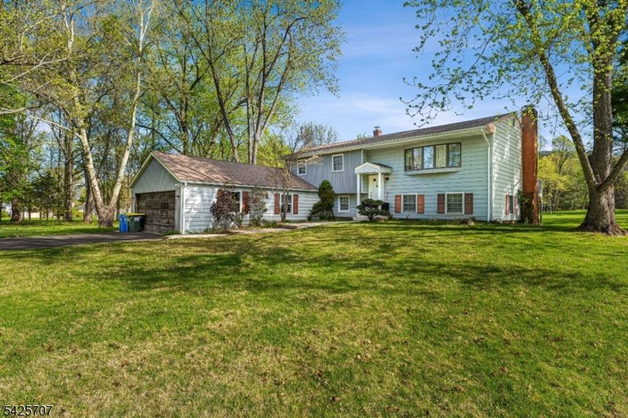 Welcome to this spacious, bright and airy retreat designed for comfortable living and entertaining. Open layout connects the living, dining, and kitchen areas, creating a seamless flow perfect for gatherings or quiet nights in.  Hardwood flooring throughout adds warmth and timeless style to every room.  The oversized garage offers room for vehicles, storage, and a workshop?whatever your lifestyle needs.  Step outside to a spacious flat yard ideal for summer barbecues, gardening, or playtime.  Tucked away on a quiet street, you?ll enjoy privacy and peace while still being close to local amenities.  With generous living space inside and out, it?s easy to make this house your new home.