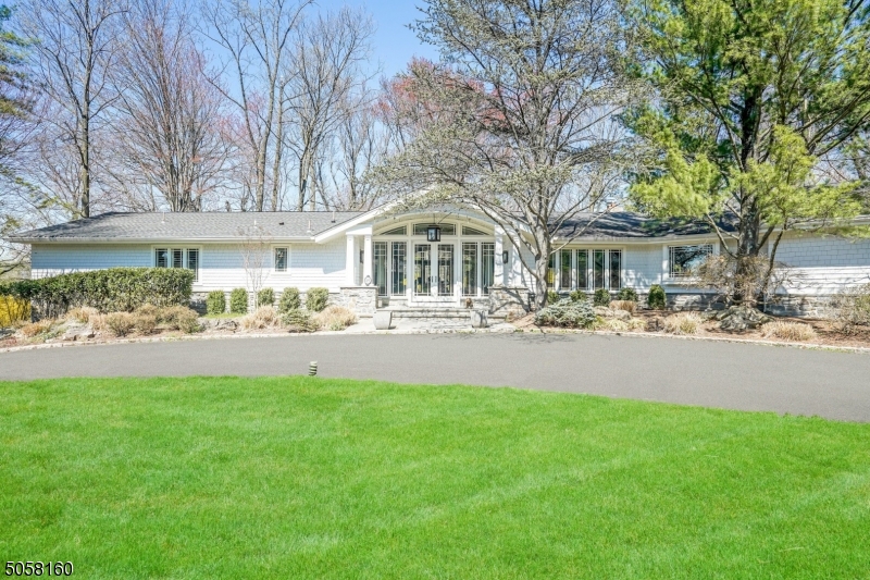 Expansive sprawling ranch on nearly one acre of flat, lush property on a quiet street in the heart of the highly desirable Deerfield section.