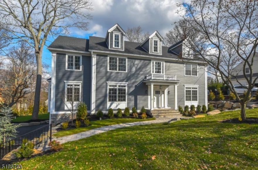 Magnificent NEW 6 bedroom, seven and a half bath, center hall colonial situated on over a third acre of park-like property. Features include "Hardie" plank & stone exterior. Gourmet kitchen w/wood cabinetry, two dish washers, six burner gas range, combination wall oven/microwave, French door refrigerator, quartz counters and tile backsplash. large pantry with SS refrigerator, butlers pantry with wine cooler. First floor bedroom w/full bath, primary bedroom includes a gas fireplace, vaulted trey ceiling, 16' X 10' walk-in closet and primary bath with vaulted ceiling, soaking tub, stall shower and heated floor. Coffered ceiling & wainscoting in dining room, living room with designer ceiling, family room w/beamed ceiling and fireplace, sun room with vaulted ceiling and exposed beams. Finished basement with wet bar, full bath and gym. Deluxe trim package, 4 zone heating & central air conditioning, central vacuum, hardwood floors, alarm system, underground sprinkler system, raised platform paver patio, three car garage and much more. Ideally located close to NYC trains, commuter buses, parks, schools, shopping and places of worship.