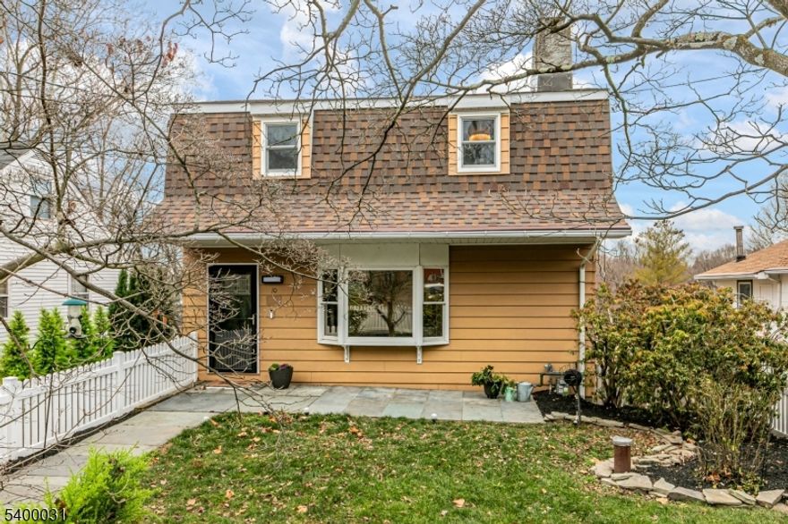 In Cottage Hill, this in-town retreat blends walkable access to Lambertville and New Hope with the peace of a quaint neighborhood. Surprising in size, the home shines with a spectacular year-round sunroom featuring walls of glass, twinkling town views, a gas stove, and mini-split AC. Thoughtful upgrades preserve charm while adding comfort, including luxury plank vinyl flooring, plush carpeting, and a beautifully updated kitchen with new countertops, backsplash, sink, and appliances. The main level offers a family room, sunroom, living room with gas fireplace, plus a full and half bath. The finished basement adds a home office with Murphy bed, second family room, storage, laundry (2023), and access to the garage and yard. Upstairs, three generous bedrooms share a spacious hall bath. Improvements include replaced windows, upgraded lighting, new exterior doors with keypads, and a new roof. A fully fenced yard completes the picture with bluestone and paver patios, shed, and space to relax, play, or entertain.