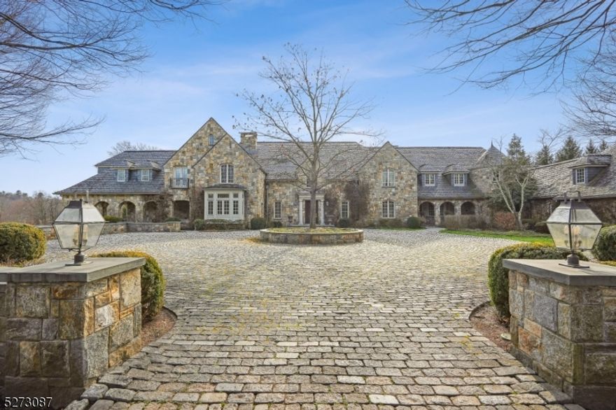 Spectacular Granite Stone Estate w/ Vermont slate roof & copper leader & gutters, designed by noted architect Hiland Turner & custom built for owner in 2001, on over 8.5 acres of stunning, totally level property, adjacent to 30 Acres of conservation property, owned by Harding Land Trust, ideally located in the heart of Harding Township. The 16,042 sq ft manor house includes incredibly high ceilings, 9 fireplaces, bluestone terraces, open porches, a stunning saltwater gunite pool, gazebo, built-in BBQ, tennis court, attached & detached garages w/ future apartment & breathtaking views of the property. This grand home offers unparalleled lux living, exquisite architectural details & high end finishes throughout. There are 7 garage bays, perfect for the car collector. The Gourmet eat-in Christopher Peacock Kitchen is a chef's paradise, & opens to Family Room, w/custom paneling & gas FP. The Living Room, w/coffered ceiling, perfect for entertaining & has dual fireplaces. The Library has floor to ceiling custom mahogany paneling, fine custom cabinetry w/gas FP & loft. The Formal Dining Room w/gas FP will impress. Billiards Room w/ FP, an ensuite bedroom, office, den w/custom built-ins, mudroom & 2 powder rooms. The lux Primary Suite w/ massive dressing rm & spa-like bath w/heated floors, soaking tub & Shower. 5 bedrooms, exercise room, sitting room/loft, & laundry room complete the 2nd flr. Lower level is beautifull w/Rec Room w/wet bar, golf simulator room & Train Rm. Low Taxes!