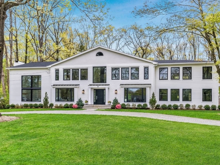 Newly-built modern masterpiece, majestically set on nearly an acre,on one of Essex Fells' most private & picturesque streets. This magnificent smart home, steps from the prestigious E.F. Country Club, provides the perfect setting for entertaining & everyday living. The 1st fl features a show-stopping 2-story Great Room w wb fireplace & floor-to-ceiling windows. At the heart of the home is the eat-in chef's kitchen/family rm w/custom white cabinetry, thick "Symphony" quartz countertops,Subzero fridge/freezer, Wolf 6 burner w grill/double oven, oversized pro accessory sink. Stunning waterfall island provides plentiful seating and storage. Custom-built fireplace,add'l cabinetry & walls of glass french doors provide light-filled views, access to outdoor dining & poolside relaxation in the private backyard oasis. Rounding out this level is the elegant LR, private home office,DR w coffered ceiling & butler's pantry, powder rm & convenient laundry/mudrm leading to oversized 2 car garage w EV charger. Upstairs features 5 all-ensuite bedrooms w/ 9 ft ceilings, walls of windows, large closets. Primary features dramatic 10 ft ceilings, 2 WIC closets, ultra lux spa bath w custom Artistic Tile, radiant heated marble floors, floating vanities, soaking tub,water closet,towel warmer. Finished bsmt w/full bath for guests or play. Heated gunite pool, large stone patios, fully fenced yard, 2-rm pool house, whole house generator, Oak floors, smart home tech, circular paver driveway, RH lighting.