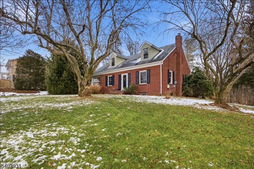 You will not believe the amount of space in this solid brick home!  Calling all builders, rehabbers and buyers looking to put some work in.  This home is entirely habitable in its current condition but is in need of updating.  You will love the private lot and how it sits above the street!  Hardwood floors throughout and walk up stairs to an abundant attic with 4 dormers begging to be finished.  Bright rooms and nice flow.  Large common area seperates the 3 first floor bedrooms.  Parklike back yard with patio, shed and very oversided 2 car garage.  Floor plans included in photos.  Ideal opportunity for an FHA 203k or Fannie Mae Homestyle Renovation loan.  Bring vision to life in Long Hill Township!  Best and Final offers due by Noon on Tuesday, 1/13/2026