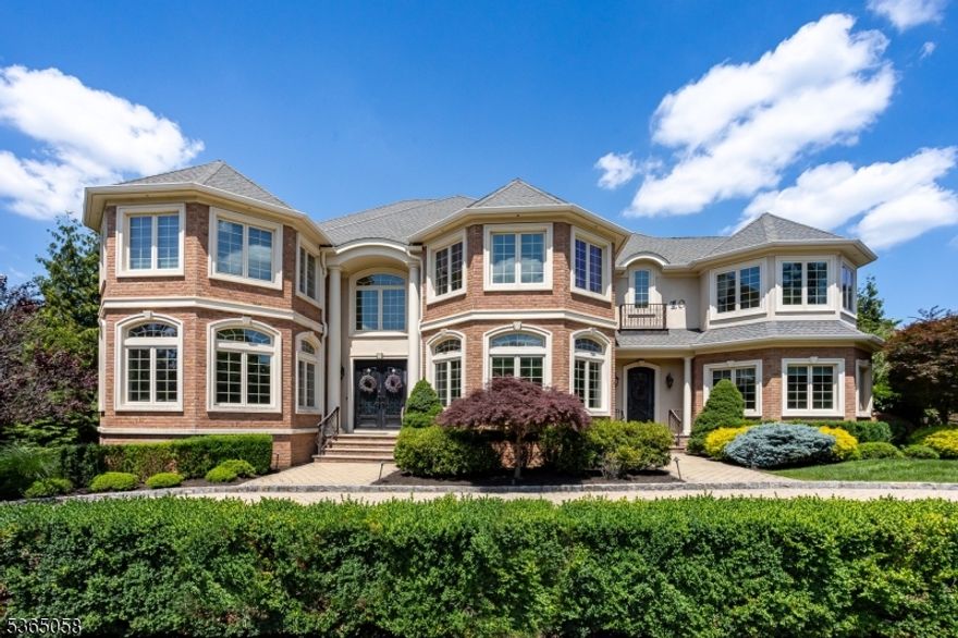 Luxury, space, and resort-style living await in this custom 6-bed, 6.1-bath estate on a quiet cul-de-sac in the coveted Bel Air Woods section of Livingston. Built in 2012 with over 6,300 sq ft, this home offers 10-ft ceilings, a chef's kitchen with top-tier Sub-Zero, Wolf, and Miele appliances, and a dramatic family room with a 20-ft ceiling, fireplace, and custom bar with additional Subzero appliances. Upstairs, the lavish primary suite features a gas fireplace and radiant heated bathroom floors, which extend to all second-floor bathrooms, the foyer, and the mudroom. A full laundry room is conveniently located on the second level. All bedrooms are en-suite, including one on the main level and a guest suite in the walk-out basement, which also features a home theater, gym, rec room, wet bar, and a 2,000-bottle temperature-controlled wine cellar. The finished walk-up attic adds bonus rec space with custom-built-ins. Enjoy radiant heat in all upstairs baths, Lutron lighting, multi-zone HVAC, a 3-car garage with EV charger, and underground utilities. The backyard is a private retreat featuring a heated saltwater pool and spa, outdoor kitchen, covered patio with electric screens, fire pit, and a custom shed. Located near top-rated schools, shopping, and NYC transit, this home is a rare find!