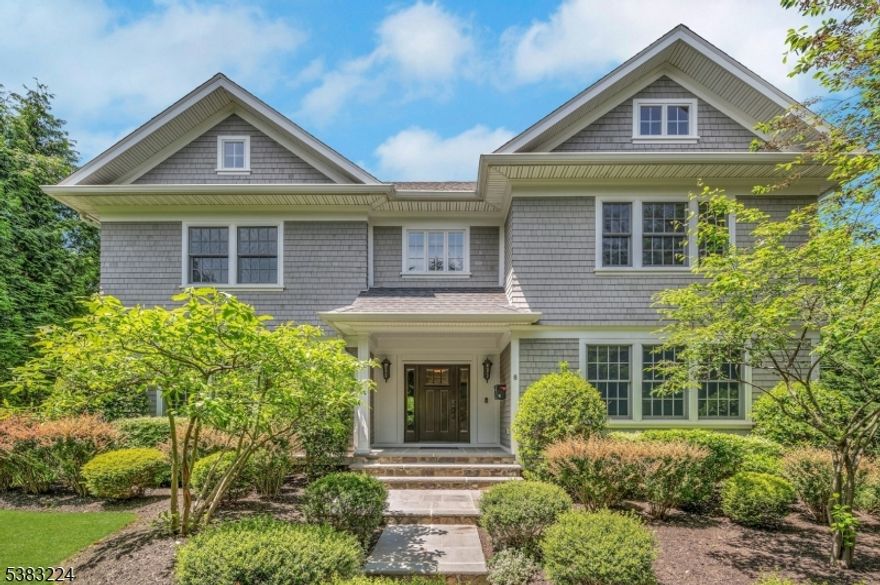 Experience luxury and functionality in this stunning, newer construction home in Summit's top-rated Lincoln-Hubbard school district. A private drive leads to this impressive shingle and stone Colonial designed by David Rosen. A grand foyer opens to the gourmet kitchen with spacious island, luxury appliances, and custom cabinetry. A breakfast area flows seamlessly into a sunlit family room with coffered ceiling, wainscotting, and gas fireplace. Step outside onto the deck, perfect for entertaining or enjoying peaceful lofty views. The first floor also features a gracious dining room with wainscotting and an octagonal beamed ceiling, an elegant living room with a gas fireplace, a private study with custom shelving and wainscotting and built-in speakers throughout the first floor and deck. Upstairs, find four large bedrooms, the laundry room and three baths, including a hall bath, en-suite, and luxurious spa-like primary bath with shower, jetted tub and dual sinks. The primary bedroom is generously sized and has a spacious walk-in closet. The lower level, finished with Italian tile floors, offers high ceilings, a full bath, a generous rec room, ample storage, and a second laundry area. Outside, extensive landscaping and hardscaping was completed by the current owners. An oversized three-car garage completes this fine home. Set in a sought-after location with top-tier schools, this home combines timeless elegance, modern amenities and privacy, an opportunity not to be missed.