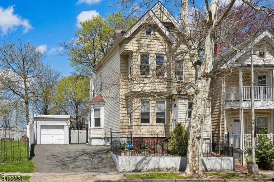 Grand & Beautiful is what you will see from the time you enter this stately four bedroom home. High ceilings, stunning hardwood floors, formal and large living room, dining room, with a grand pocket door and a full bath on the main level. Crown molding throughout with a lovely chandlier's at the entry of this home. Updated and move-in-ready with a brand new furnace that will keep you warm for many years to come. The 4 large bedrooms gives this home another bonus point! The gated and private yard is great for entertaining. Location is terrific to catch the NYC bus or train or 280HWY, or GSP as well.