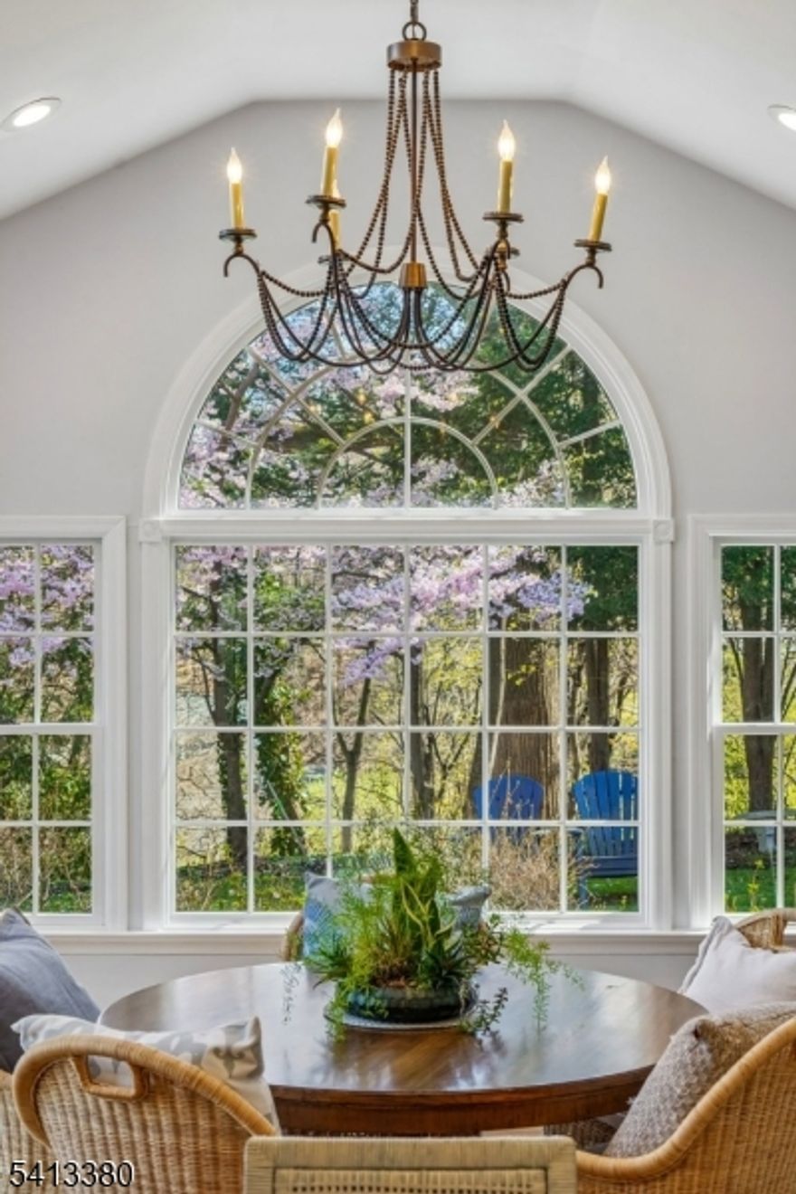 Wonderful Ranch-style home located on Summit's desirable Northside in the sought-after Lincoln Elementary School District. Move-in ready and filled with natural light, the home features an open floor plan with a spacious Living Room that flows seamlessly into the Dining Room ideal for everyday living and entertaining.The eat-in Kitchen opens to a huge breakfast room with vaulted ceiling, skylight and a striking Palladian window overlooking private property. The adjacent den completes the main living area. The first floor offers three generously sized bedrooms with ample closet space and two full bathrooms. The finished lower level provides exceptional flexibility with a Recreation Room, full bath, reading nook, and office. Additional highlights include an oversized two-car garage with abundant storage, plus walk-up attic storage. Set on a beautiful, half-acre lot, this home offers flexible living for many different lifestyles.  Fireplace, chimney, flues to be purchased in as-is condition.  Gas FP in LR as-is.