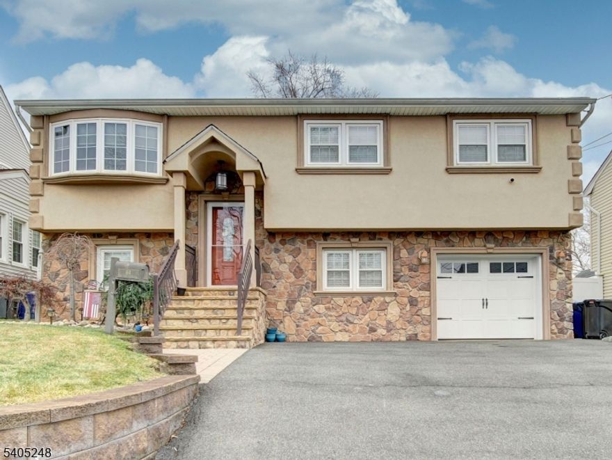 Pride in Ownership! Gorgeous Stucco and Stone Bi-Level home with many upgrades throughout. 5 bedrooms, 2 full baths, a beautiful kitchen and dining room. Granite, tile, wood floors... Large family room with gas fire place. New patio and walk way, sun setter awning in the back yard, sprinkler system, new furnace, and water heater. List goes on. Home needs nothing but your bags! Meticulously maintained home. Pics coming soon!